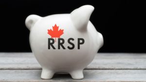 White piggy bank with RRSP and maple leaf